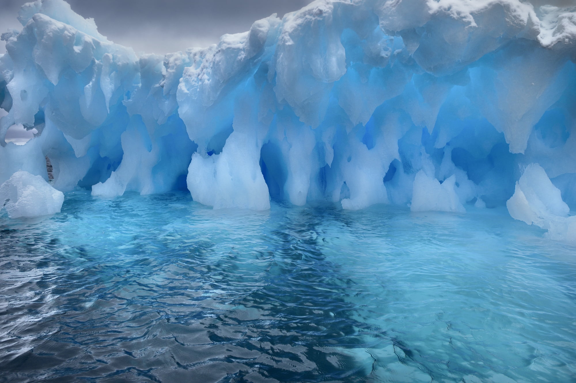 Iceberg eroded by waves. Booth Island, Antarctica